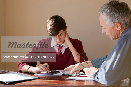 Father helping son with homework