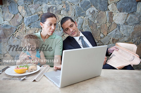 Family working at breakfast table