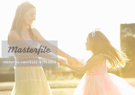 Sisters playing together outdoors