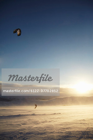 Man windsurfing on snow