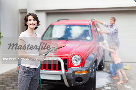 Family washing car together