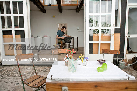 Table and chairs in artist's courtyard