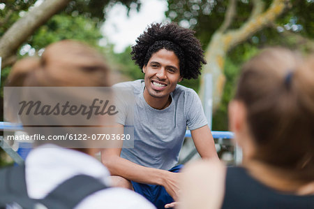 Man sitting on bleachers in park