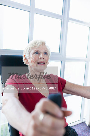 Older woman exercising in gym