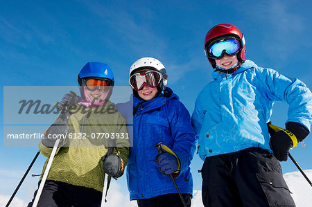Smiling children wearing ski gear
