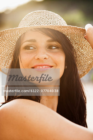 Smiling woman wearing sunhat