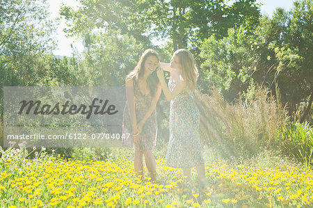 Teenage girls in field of flowers
