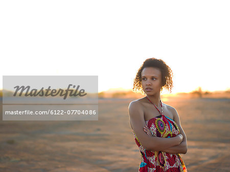 Woman standing in desert landscape