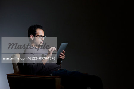 Man using tablet computer