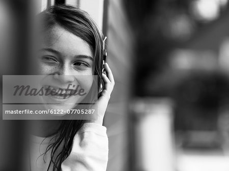 Smiling girl talking on cell phone