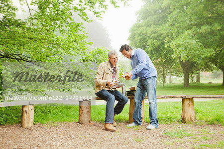 Men talking in park