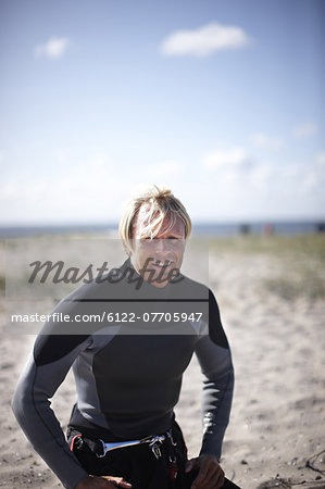 Smiling man resting on beach