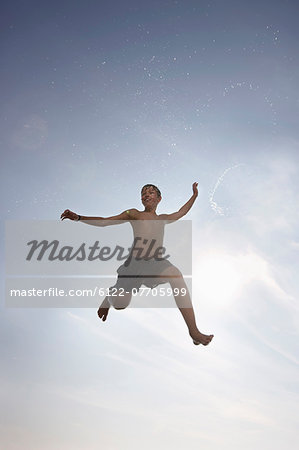 Boy posing in mid-air