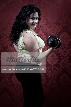 Woman lifting weights at home