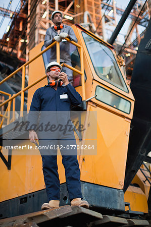 Worker using walkie talkie on site