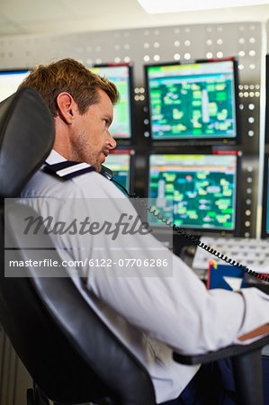 Man working in security control room