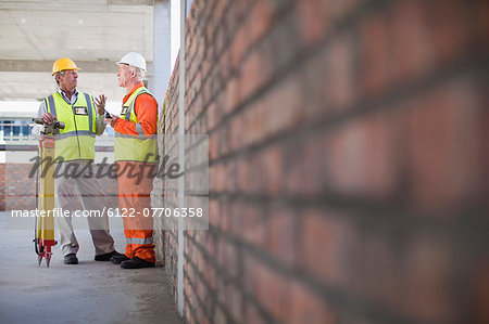 Workers talking at construction site
