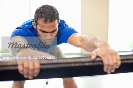 Man stretching in gym