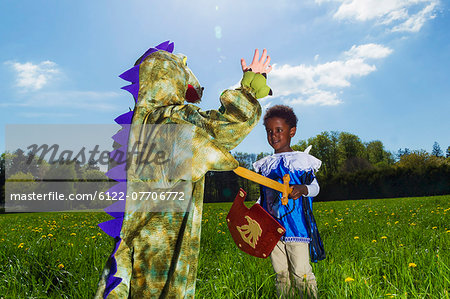 Boys playing dress up outdoors