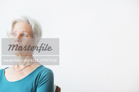 Older woman sitting in chair