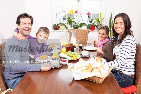 Family eating breakfast at table
