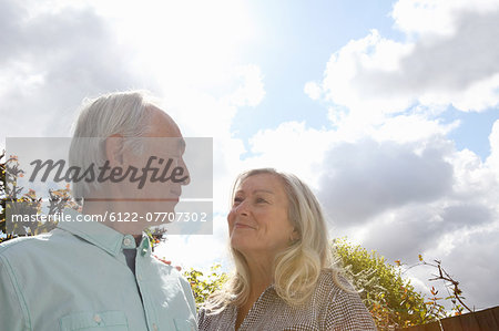 Older couple standing outside together