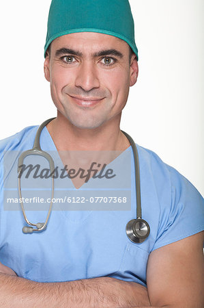 Smiling surgeon wearing stethoscope