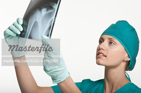 Surgeon examining x-rays