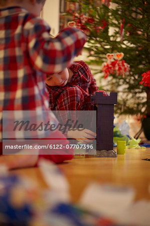 Children opening Christmas gifts