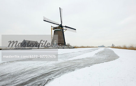 Windmill in snowy landscape