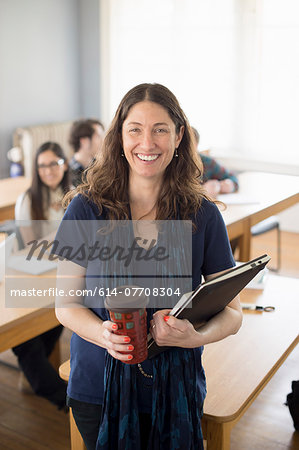 Teacher with notebook and coffee, portrait