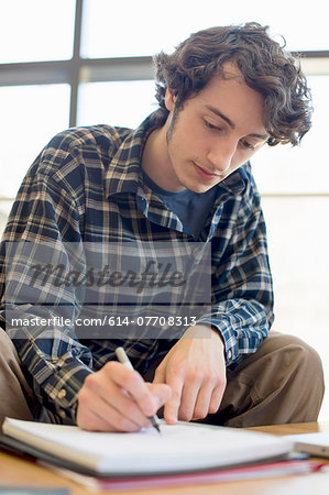 Student making notes Student making notes