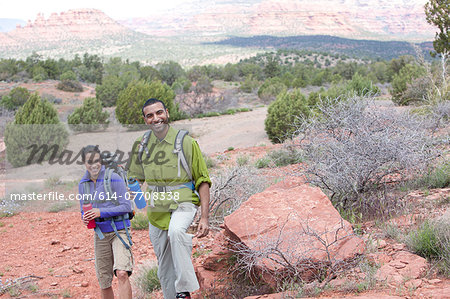 Couple with water bottles out hiking, Sedona, Arizona, USA