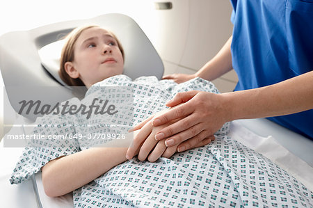 Girl going into CT scanner Girl going into CT scanner