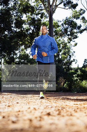 Male jogger in forest