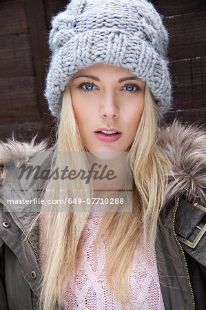 Portrait of young woman in knitted hat