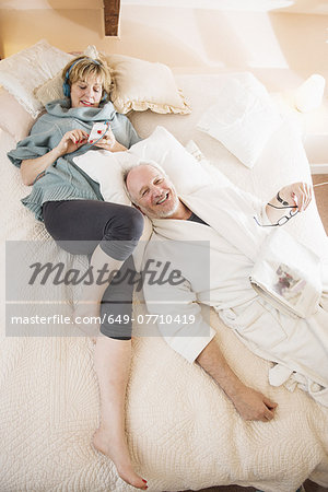 Couple lying on bed relaxing
