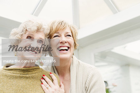 Senior woman with daughter, laughing