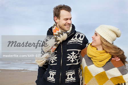 Portrait of mid adult couple strolling on beach, Bloemendaal aan Zee, Netherlands