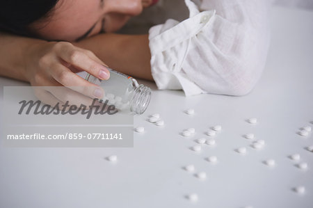 Young Japanese woman sick after swallowing pills