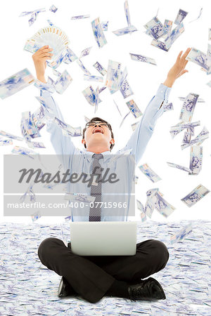 business man winning a lottery with money rain background