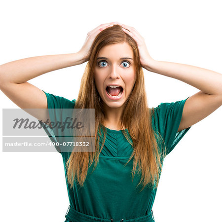 Portrait of a beautiful girl with a panic expression isolated on white background