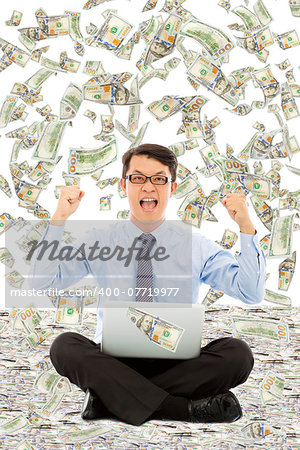 business man make a victory gesture with money rain