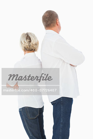 Upset couple not talking to each other after fight on white background