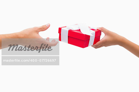 Woman passing man a gift on white background