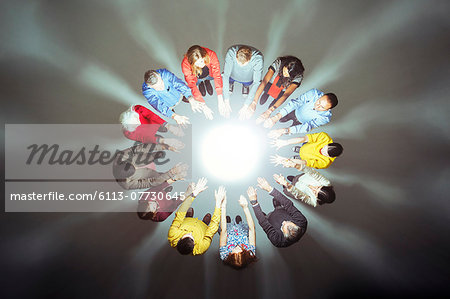 Crowd forming circle around bright light Crowd forming circle around bright light