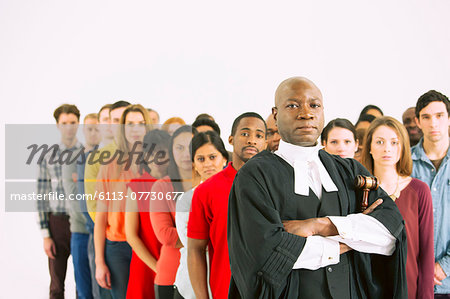 Serious judge in front of crowd Serious judge in front of crowd
