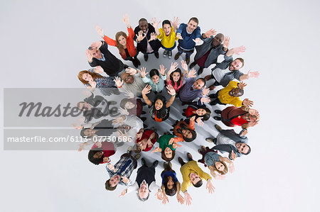 Portrait of enthusiastic business people in circle