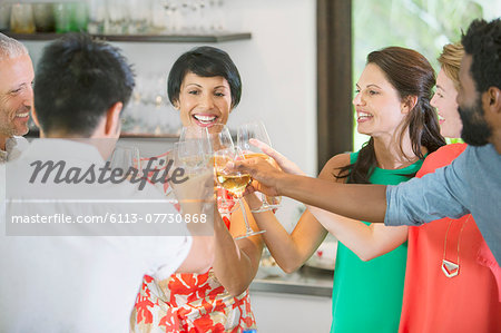 Friends toasting each other at party