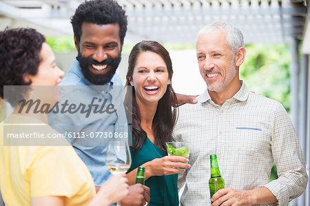 Friends laughing at party